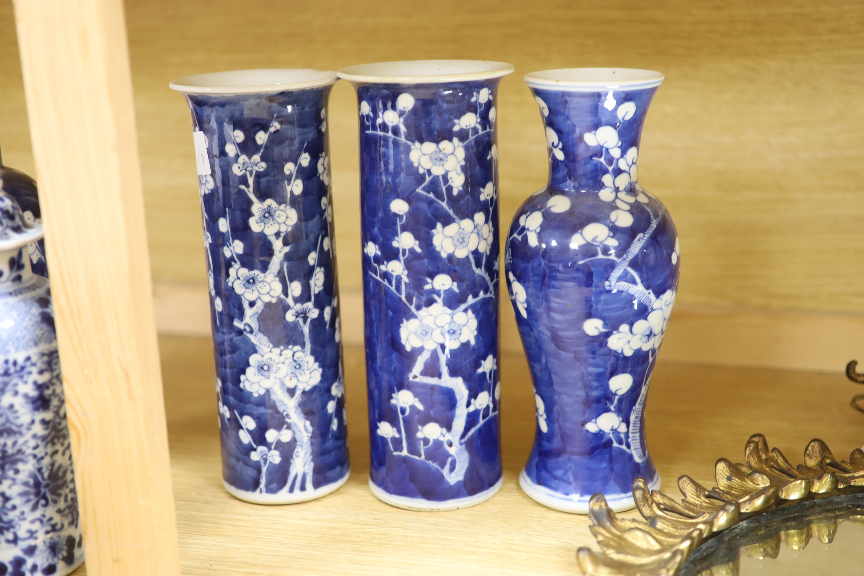 Four Chinese prunus pattern vases and a vase and cover, tallest 26.5cm